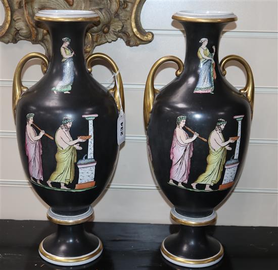 A pair of Greek decorated two handled vases